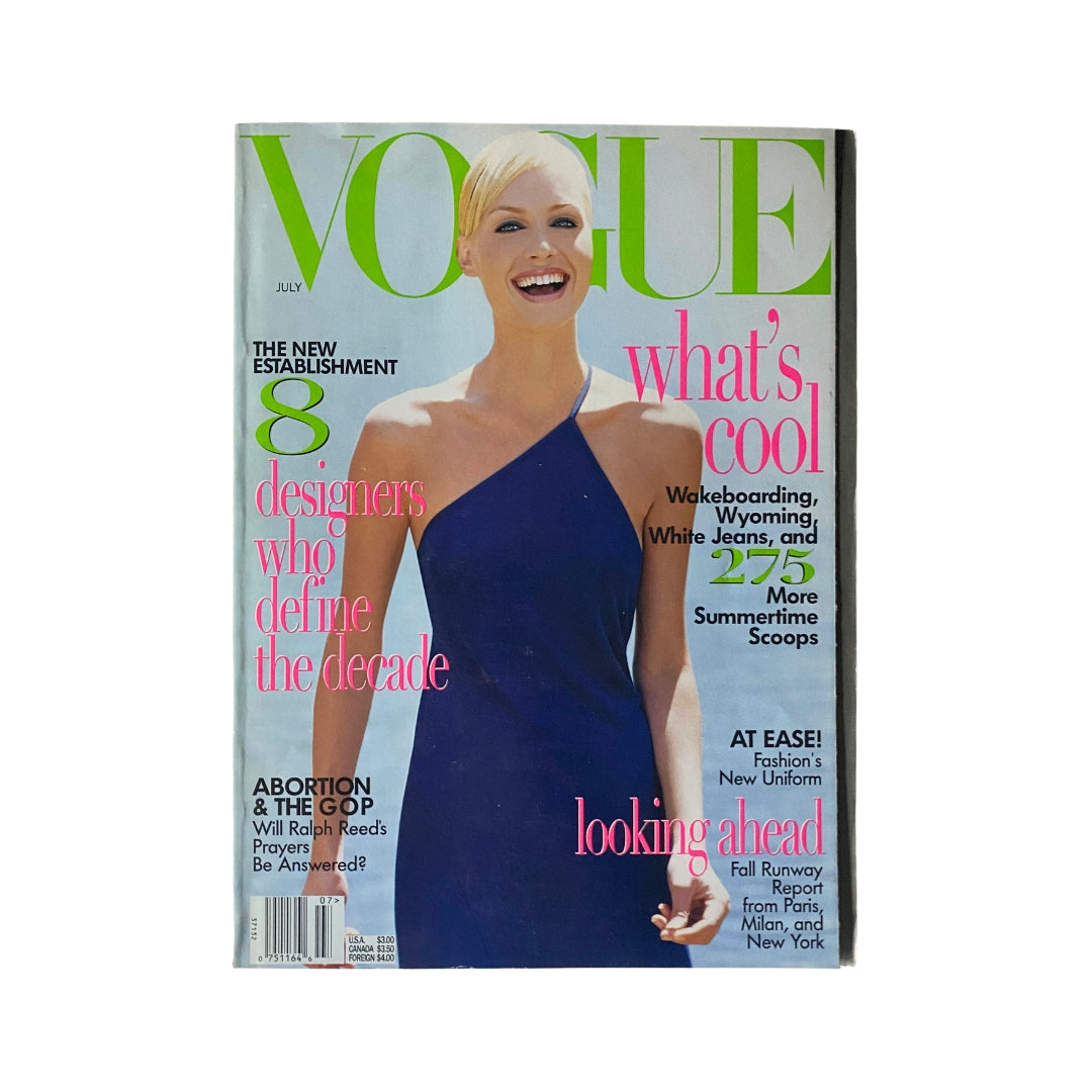 Vogue Magazine July 1996 Amber Valletta Cover showcasing the stunning model in a sleek blue dress, representing 90s fashion trends.