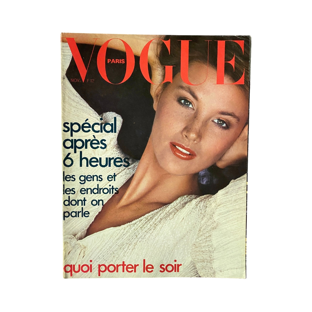 Cover of Vogue Paris Magazine November 1974 featuring a model with soft features and red lips, highlighting the theme of the issue 'Spécial après 6 heures' and the title 'quoi porter le soir'.