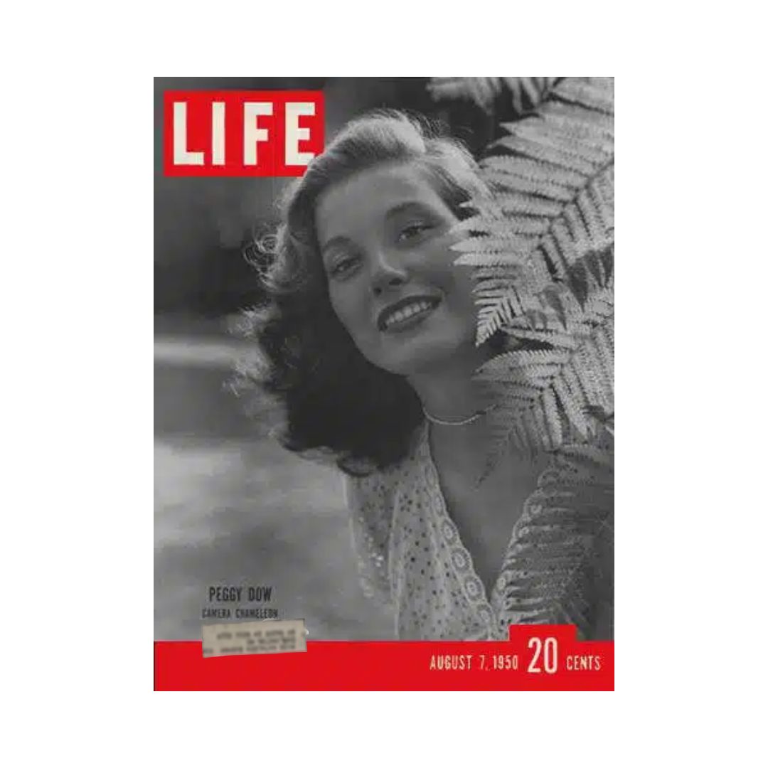Cover of VTG Life Magazine from August 7, 1950, featuring a smiling Peggy Dow surrounded by greenery, with the title 'Life' prominently displayed.