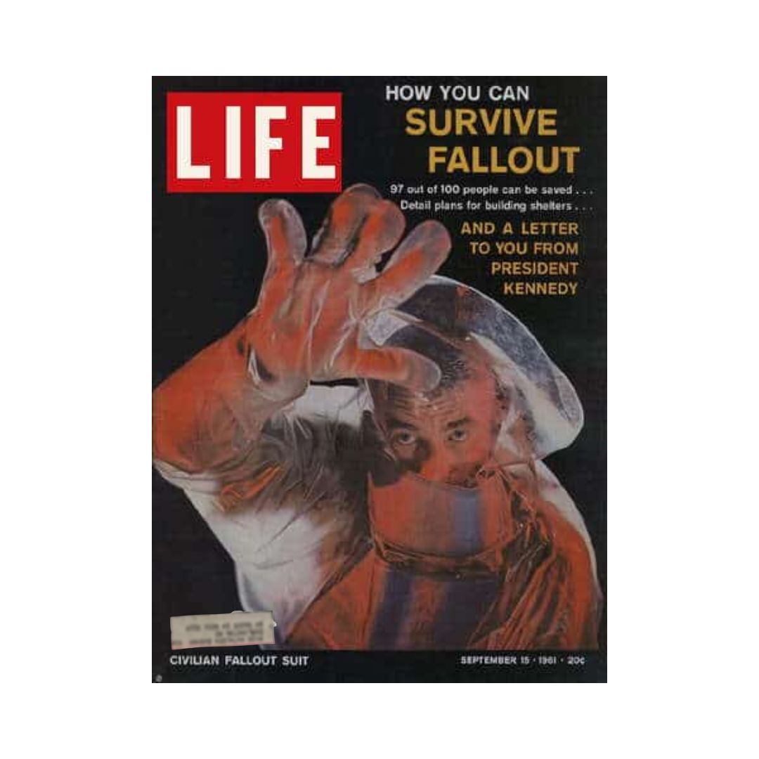Vintage Life Magazine from September 15, 1961, titled 'How to Survive Nuclear Bomb Fallout.' The cover features a man in a civilian fallout suit, emphasizing safety tips and survival information. The magazine discusses potential survival strategies highlighted by a letter from President Kennedy.