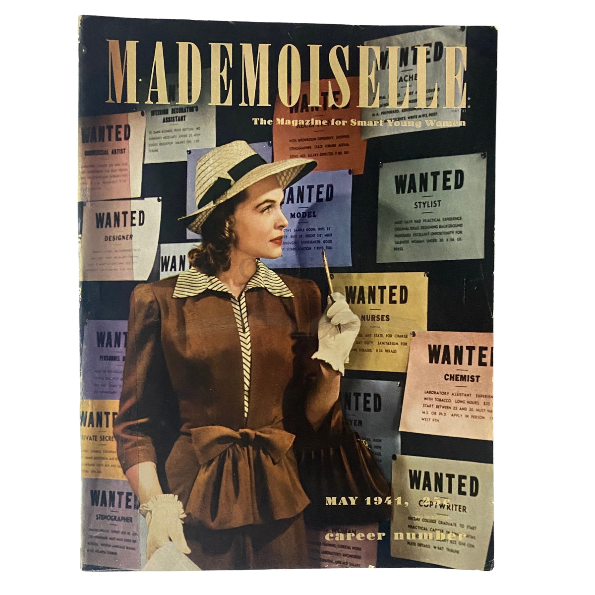 Cover of the Mademoiselle Magazine May 1941 Career Number featuring a woman dressed in vintage attire, standing in front of 'Wanted' job postings.