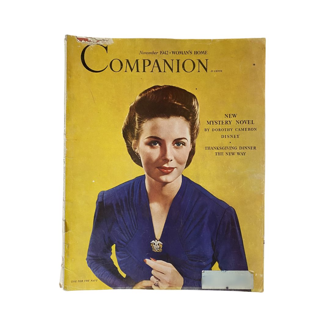 Cover of Woman's Home Companion Magazine November 1942 featuring a woman in a blue outfit and the headline 'Thanksgiving Dinner The New Way', capturing the essence of wartime Thanksgiving celebrations.