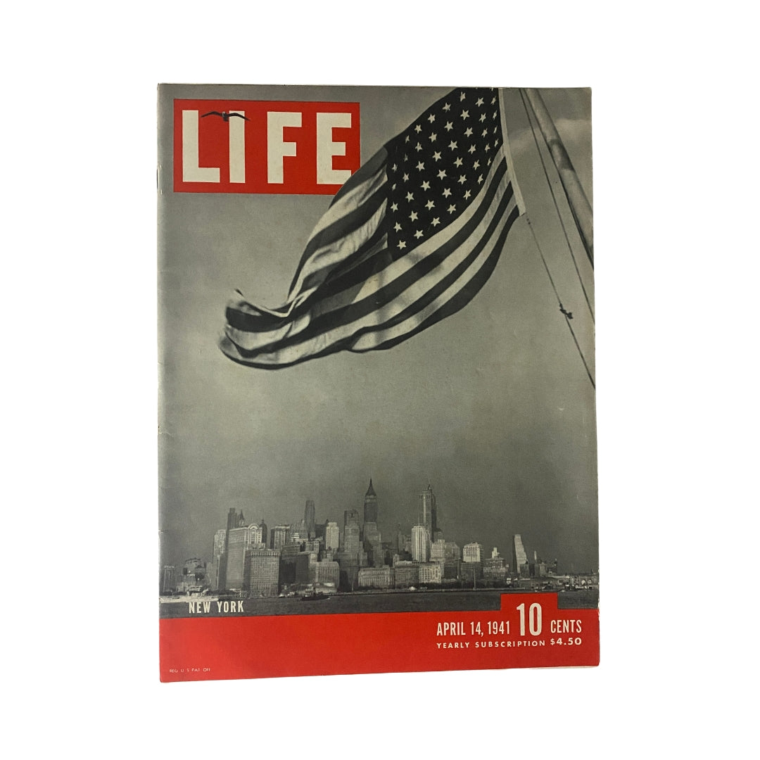 Cover of Life Magazine from April 14, 1941, featuring a striking image of the New York City skyline with an American flag, capturing a significant era in history.