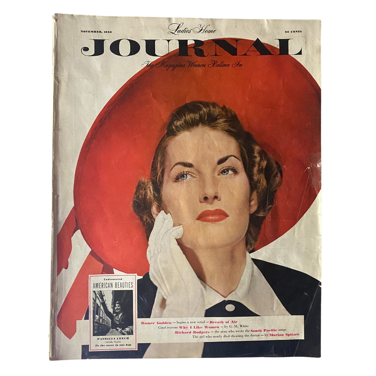 Ladies' Home Journal Magazine November 1950 cover featuring a woman with a red hat, reflecting mid-century fashion and style.
