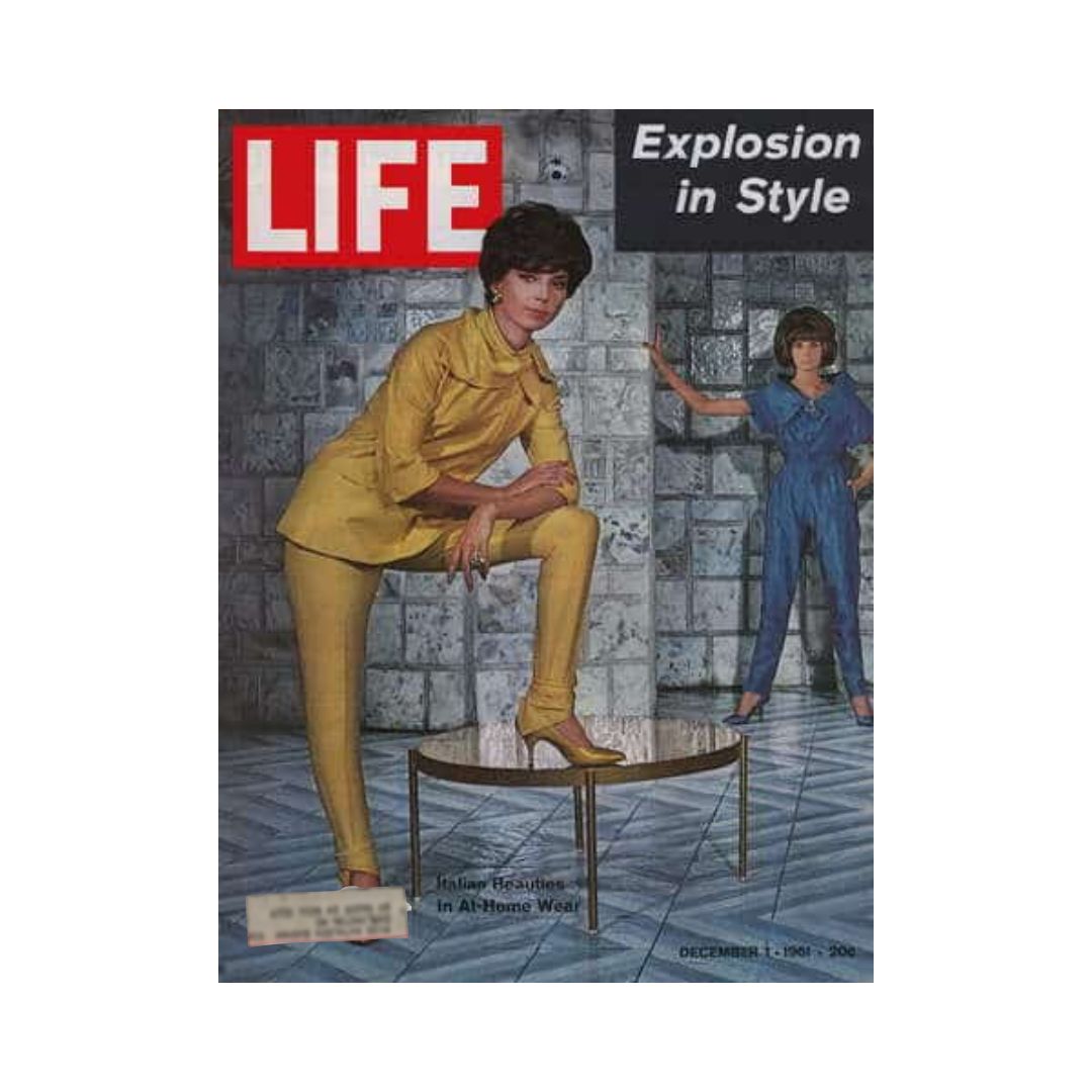 Life Magazine cover from December 1, 1961, featuring Italian fashion with models showcasing vibrant styles; one model in yellow attire posing on a table and another in blue, representing the fashion trends of the early 1960s.