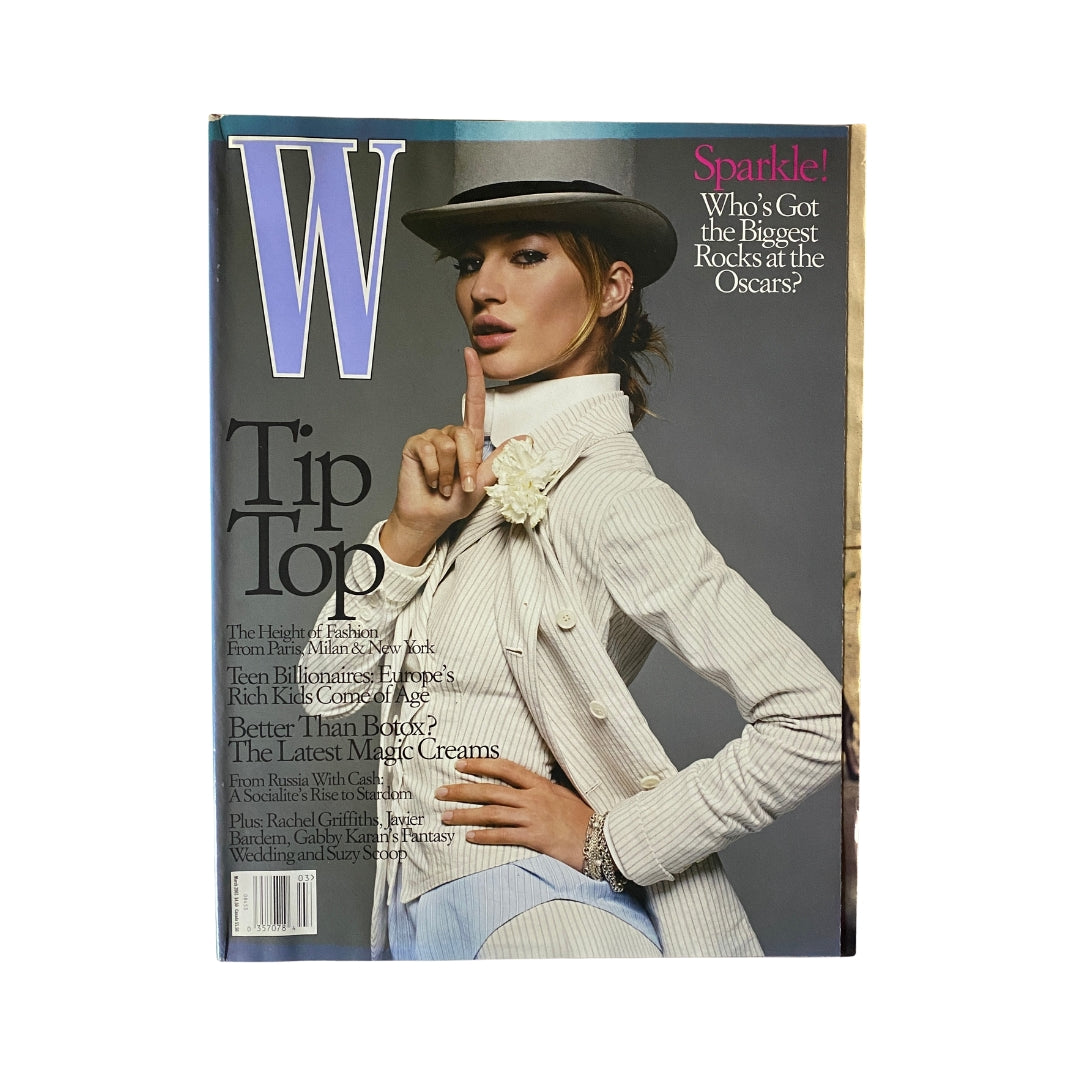 W Magazine March 2003 cover featuring Gisele Bündchen, showcasing her fashion style with a striking pose and hat, highlighting the iconic trends of early 2000s fashion.