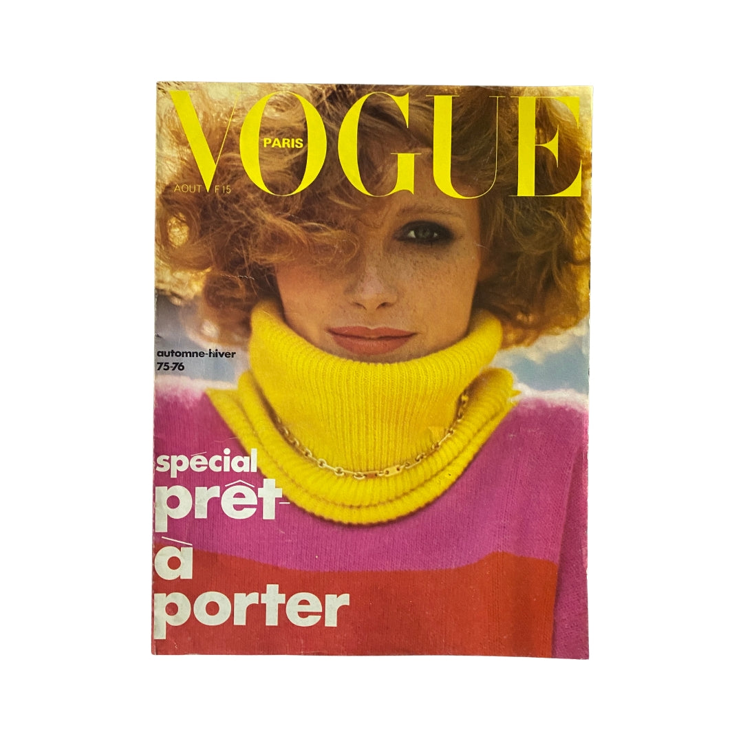 Cover of Vogue Paris Magazine August 1975 featuring a woman in vibrant pink and yellow sweater, showcasing 1970s fashion trends.