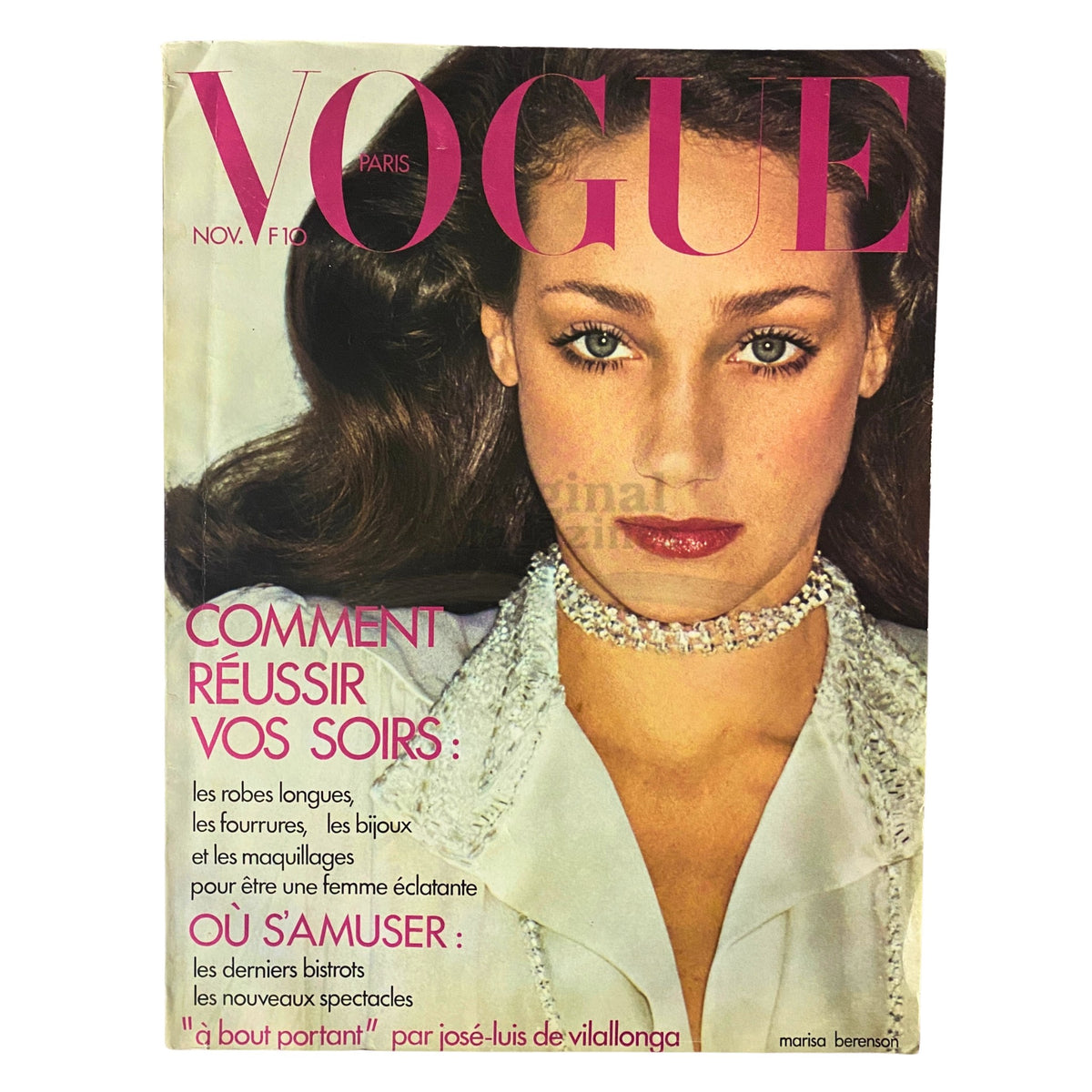 Cover of Vogue Paris Magazine from November 1973 featuring Marisa Berenson. The magazine highlights vintage fashion trends with a striking portrait of Berenson and bold typography.