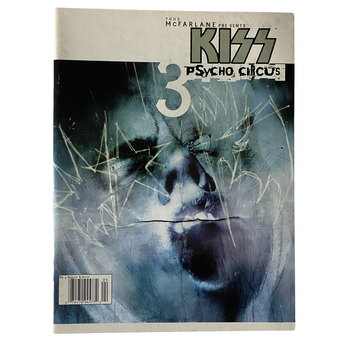 Cover of the 1999 Todd McFarlane Presents Kiss Psycho Circus magazine, featuring a striking and artistic depiction of a face expressing intensity, with the magazine title prominently displayed.