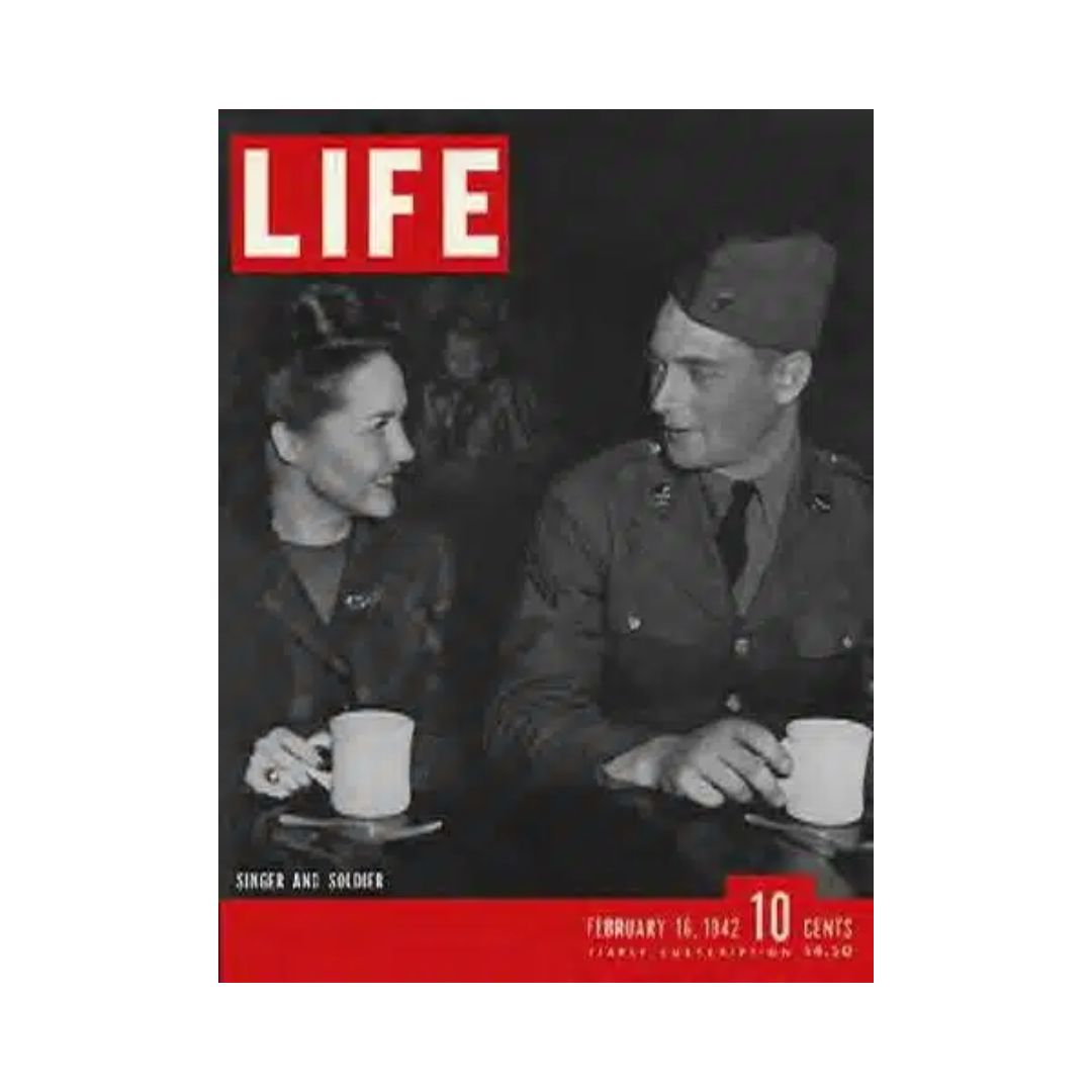 VTG Life Magazine February 16, 1942 cover featuring a USO singer and a soldier sharing a moment, reflecting camaraderie and resilience during World War II, with the iconic LIFE logo prominently displayed.