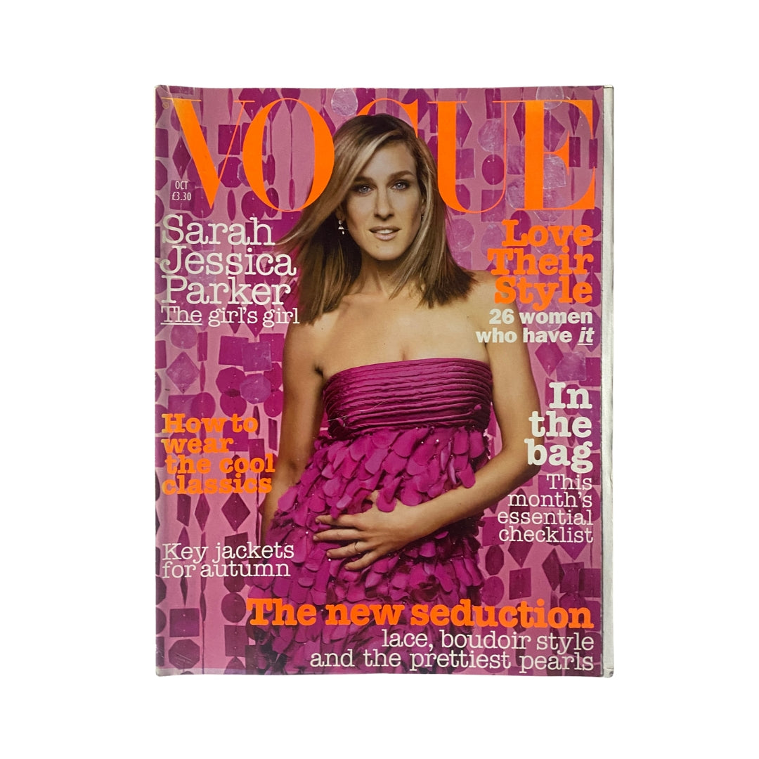 Vogue Magazine October 2003 cover featuring Sarah Jessica Parker, showcasing a bright pink dress and highlighting style, fashion, and beauty trends of that era.