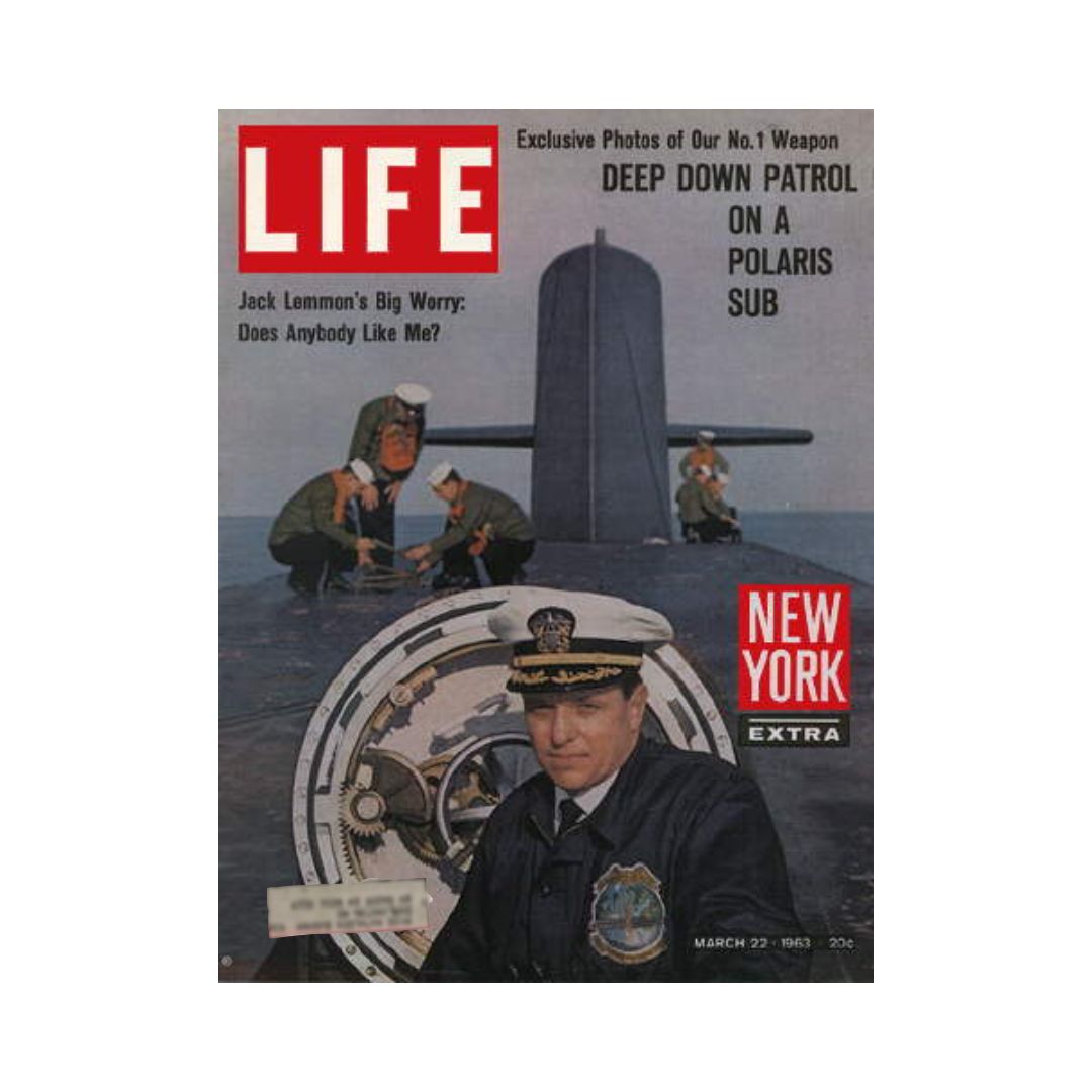 Cover of the vintage Life Magazine from March 22, 1963, featuring the headline 'Deep Down Patrol on Polaris Sub'. The image displays a submariner in uniform with a submarine in the background, showcasing Cold War naval technology.