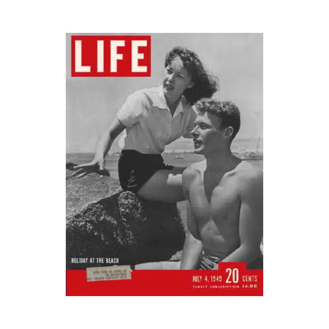 Cover of vintage VTG Life Magazine from July 4, 1949, featuring a man and woman at the beach, capturing the theme 'Holiday at the Beach'.