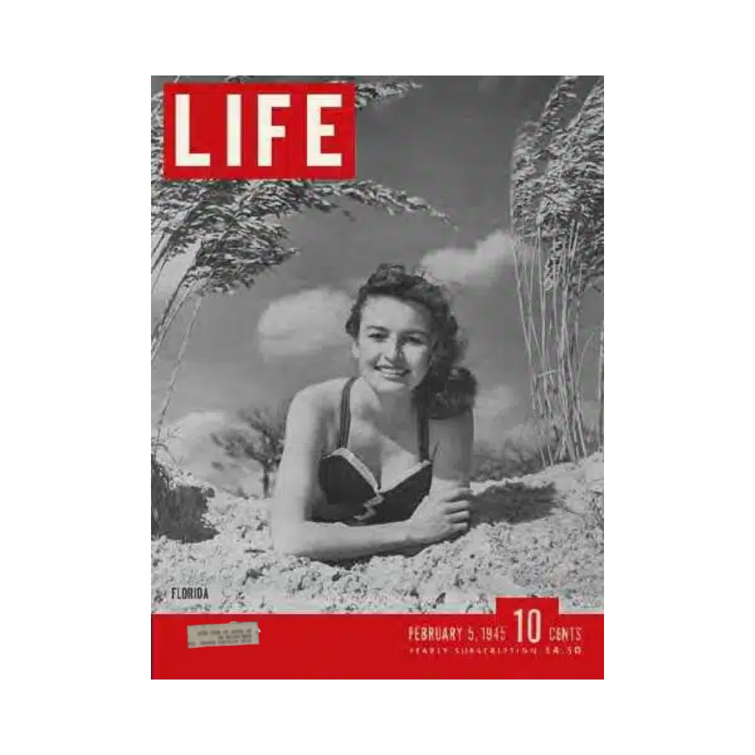 Cover of VTG Life Magazine from February 5, 1945 featuring Amelia Crossland in Florida, highlighting a vintage photograph of a woman enjoying the sun on the beach.