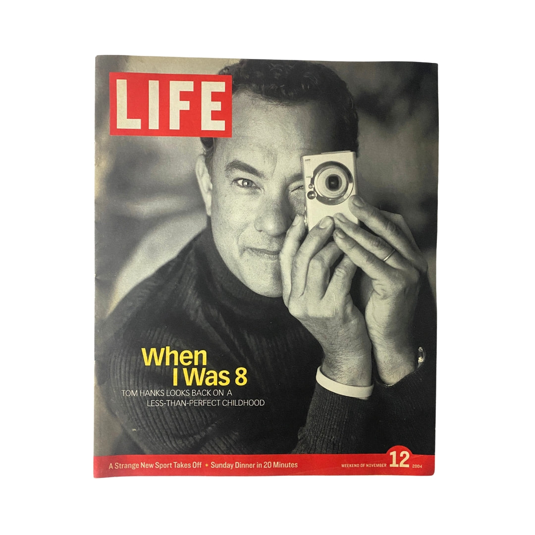 Life Magazine November 12, 2004 featuring Tom Hanks on the cover, showcasing a nostalgic portrait of Hanks with a camera, reflecting on his childhood.