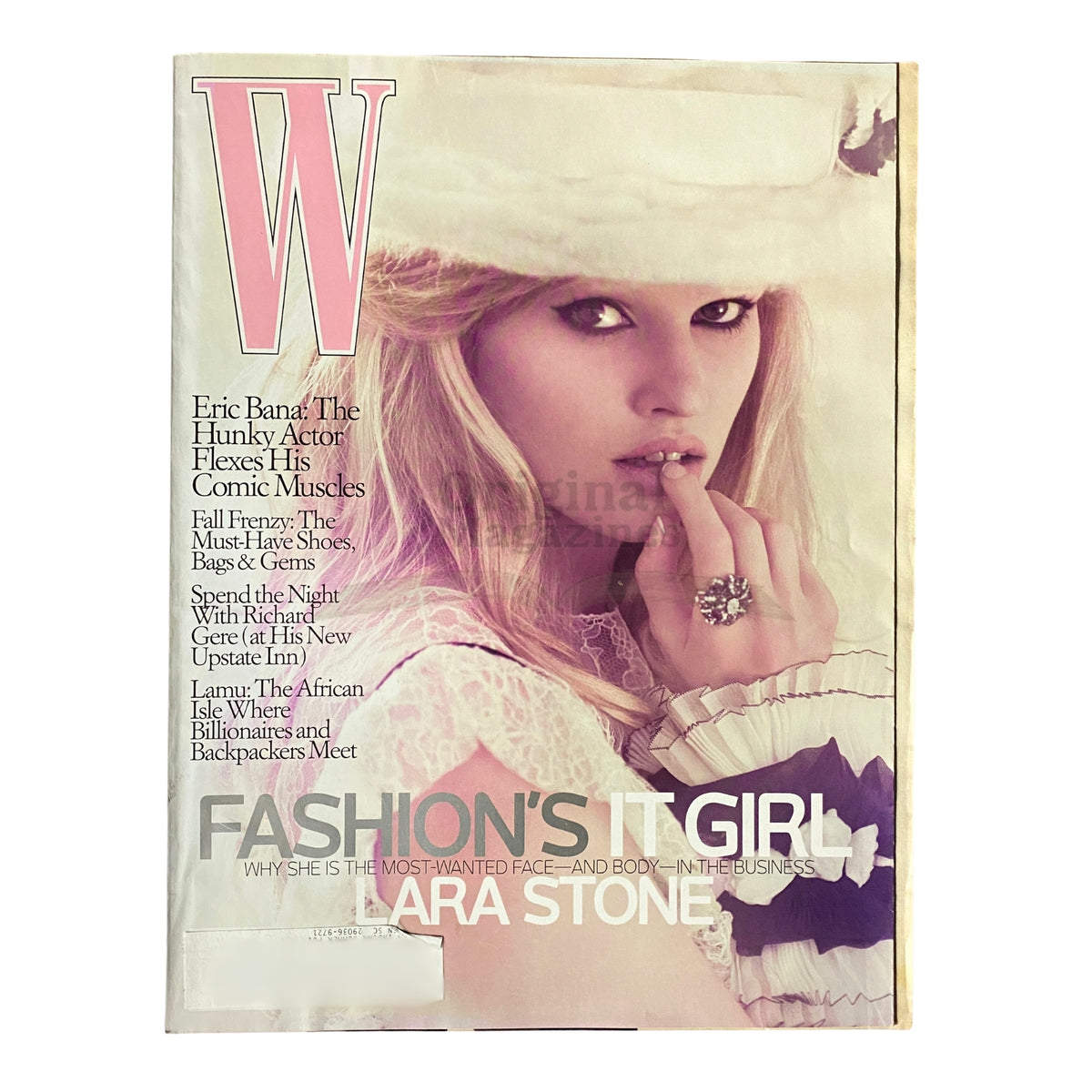 W Magazine August 2009 cover featuring Fashion's It Girl Lara Stone, showcasing her stunning beauty and fashion style.