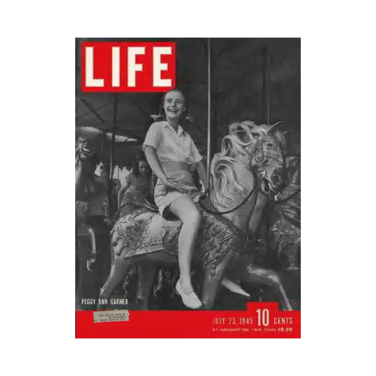 VTG Life Magazine July 23, 1945 featuring Peggy Ann Garner on the cover, depicting her joy while riding a carousel horse.