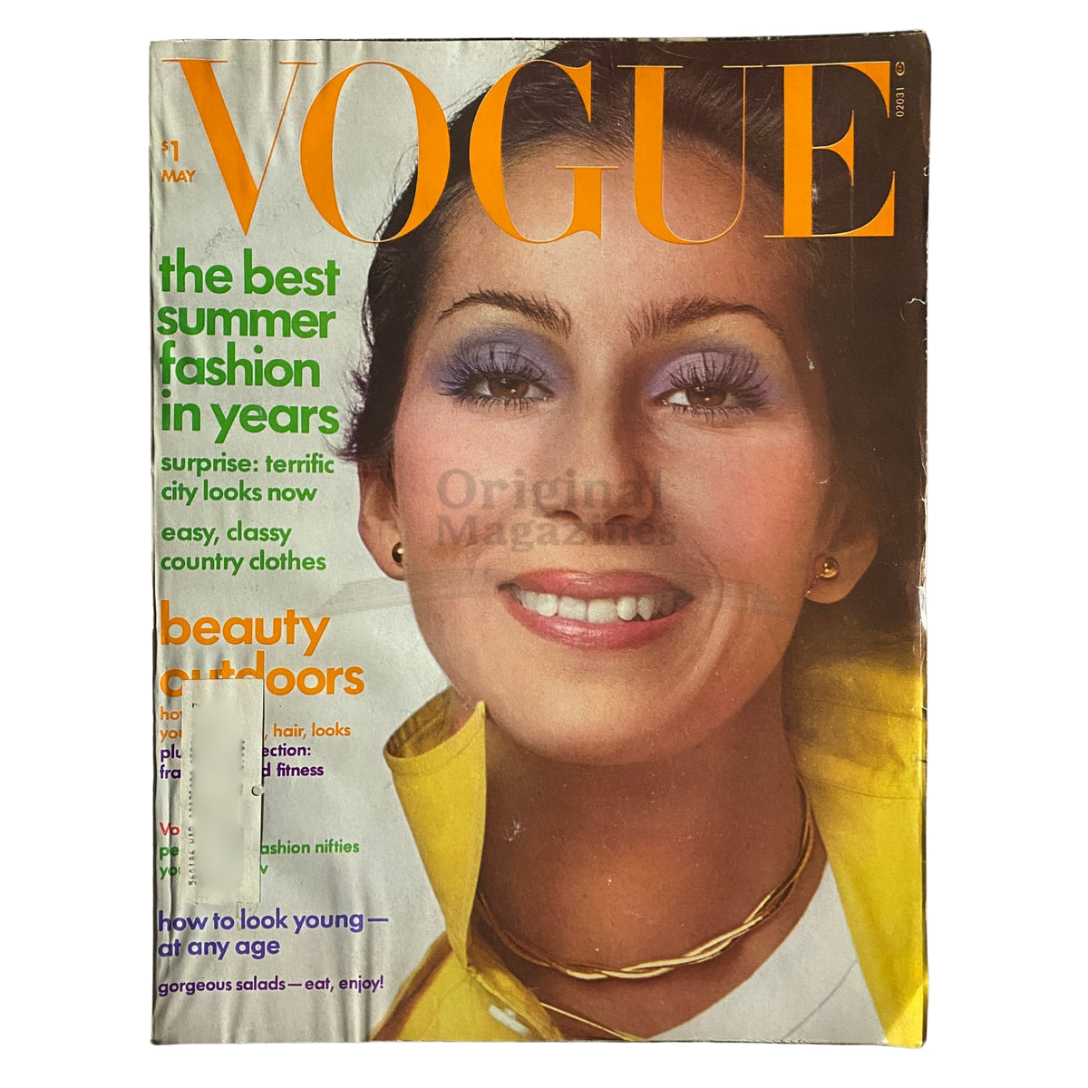 Vogue Magazine May 1974 featuring Cher on the cover, showcasing vibrant 1970s fashion and beauty trends.