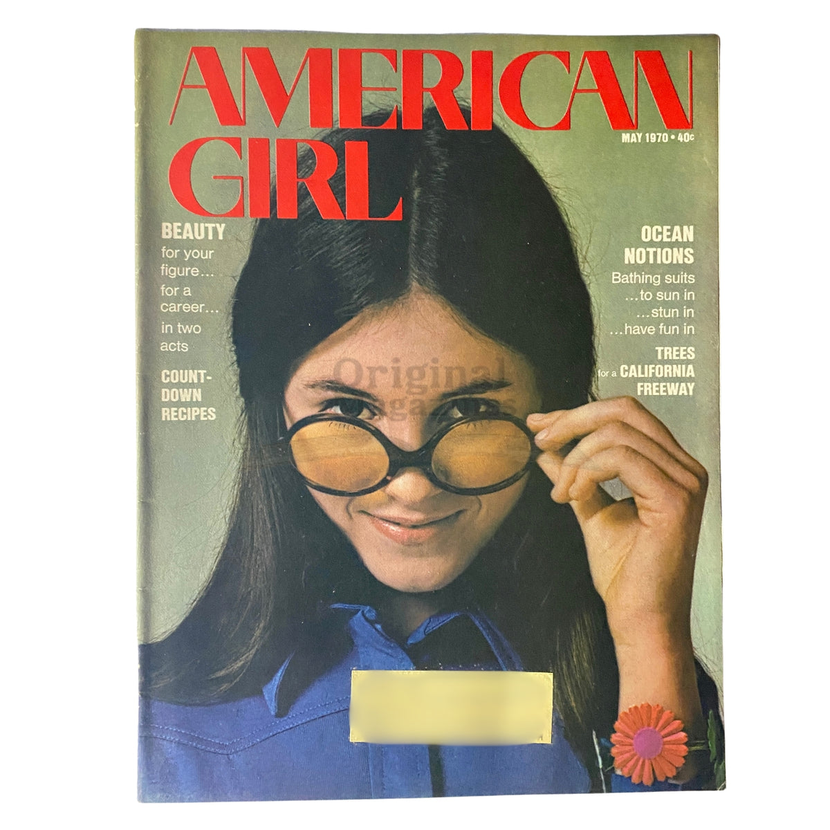 Cover of American Girl Magazine, May 1970, featuring a girl wearing sunglasses, highlighting the theme of beauty and fashion alongside articles on career and recipes.