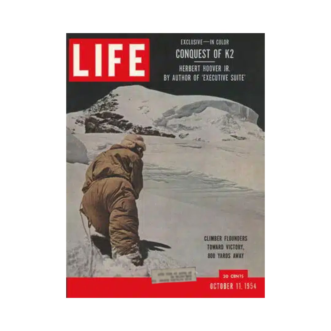 Cover of VTG Life Magazine October 11, 1954 featuring 'Conquest of K2 Mountain'. The image depicts a climber ascending a snowy peak, symbolizing adventure and historical significance in mountaineering.
