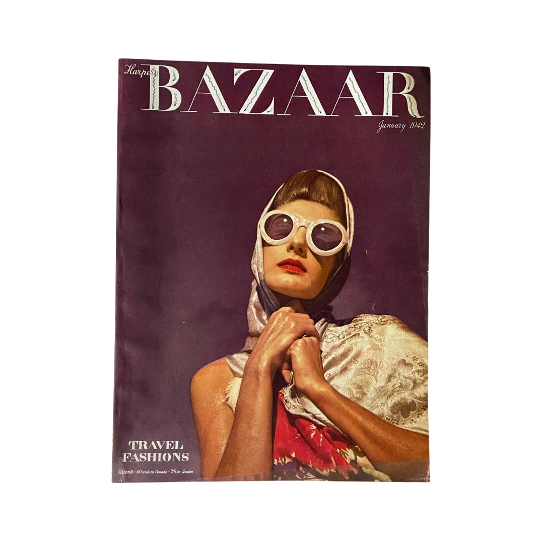 Harper's Bazaar Magazine January 1942 cover featuring a fashionable model wearing oversized sunglasses, showcasing travel fashions against a purple background.