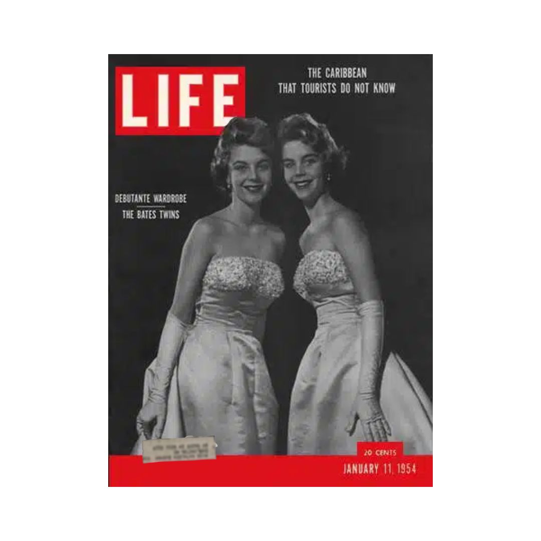 Vintage Life Magazine cover from January 11, 1954, featuring the Bates Twins in elegant debutante fashion, showcasing the glamour and style of the early 1950s.