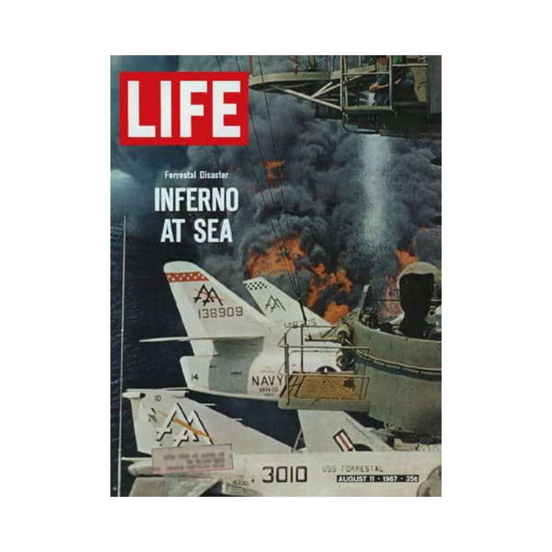 Cover of Vintage Life Magazine dated August 11, 1967, featuring the U.S.S. Forrestal Disaster, with the title 'Inferno at Sea' and images of Navy aircraft amid smoke and chaos.