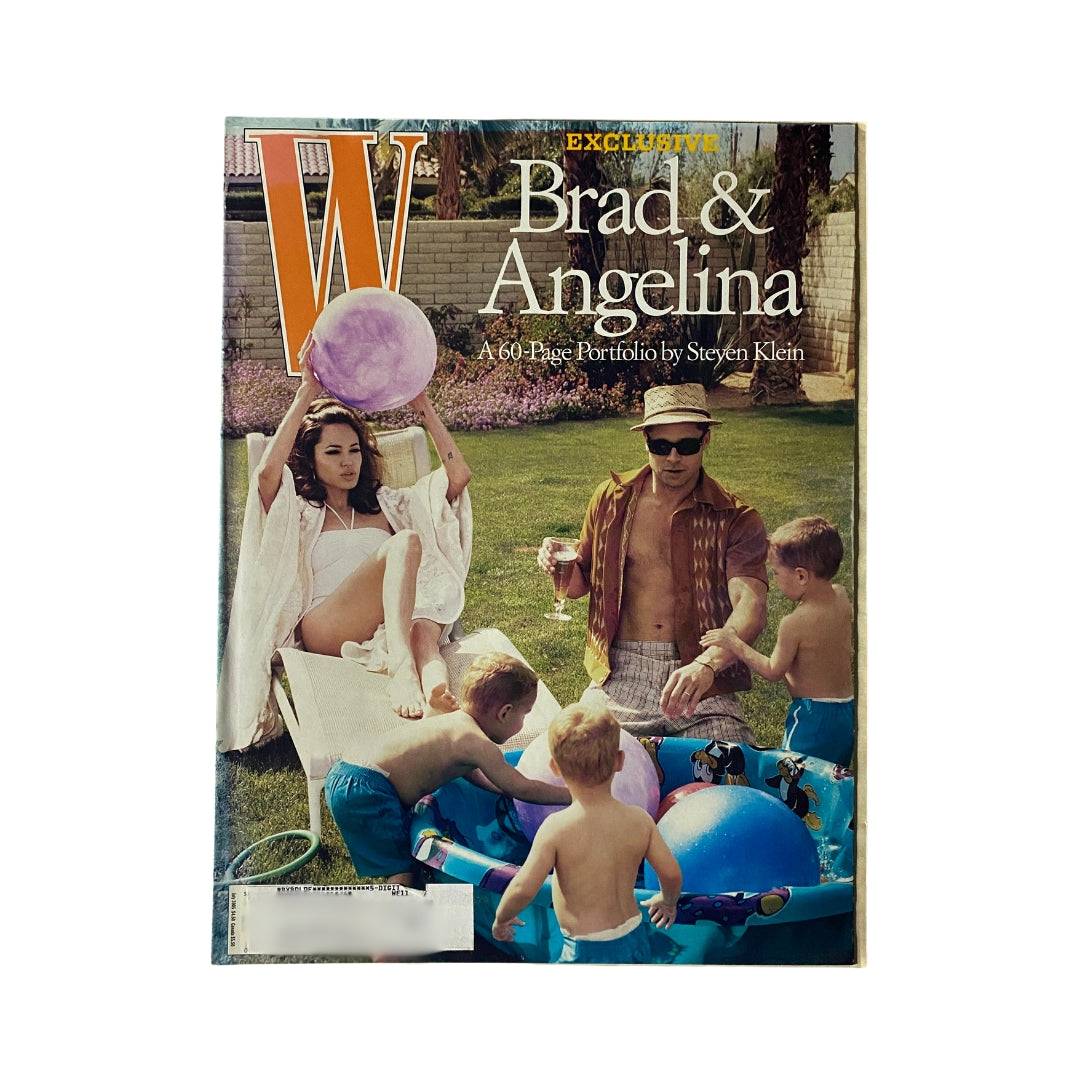 W Magazine July 2005 cover featuring Brad Pitt and Angelina Jolie surrounded by children at play, showcasing a casual family moment.