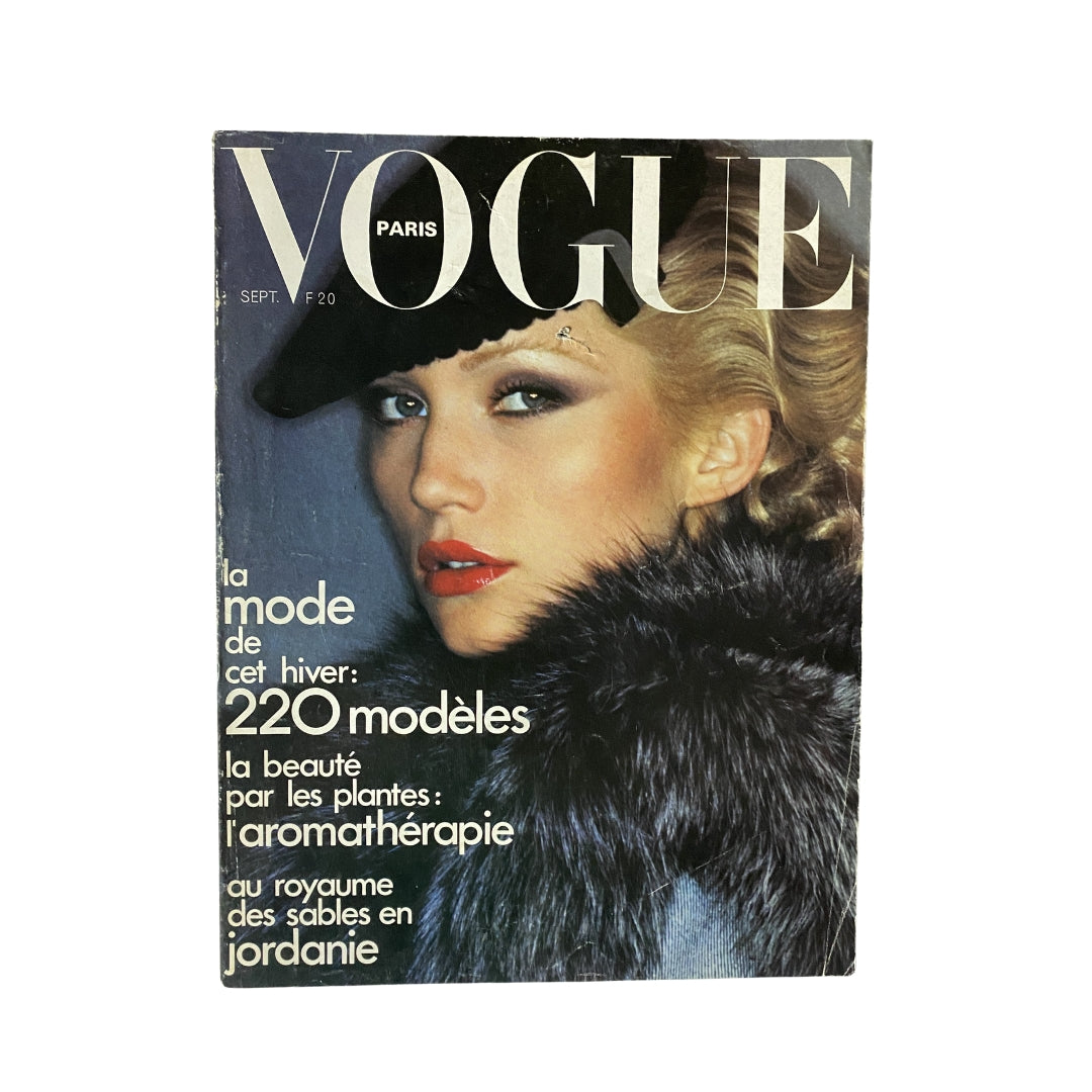 Vogue Paris Magazine September 1974 featuring Anna Andersen on the cover, showcasing 1970s fashion with elegant makeup and a fur wrap.