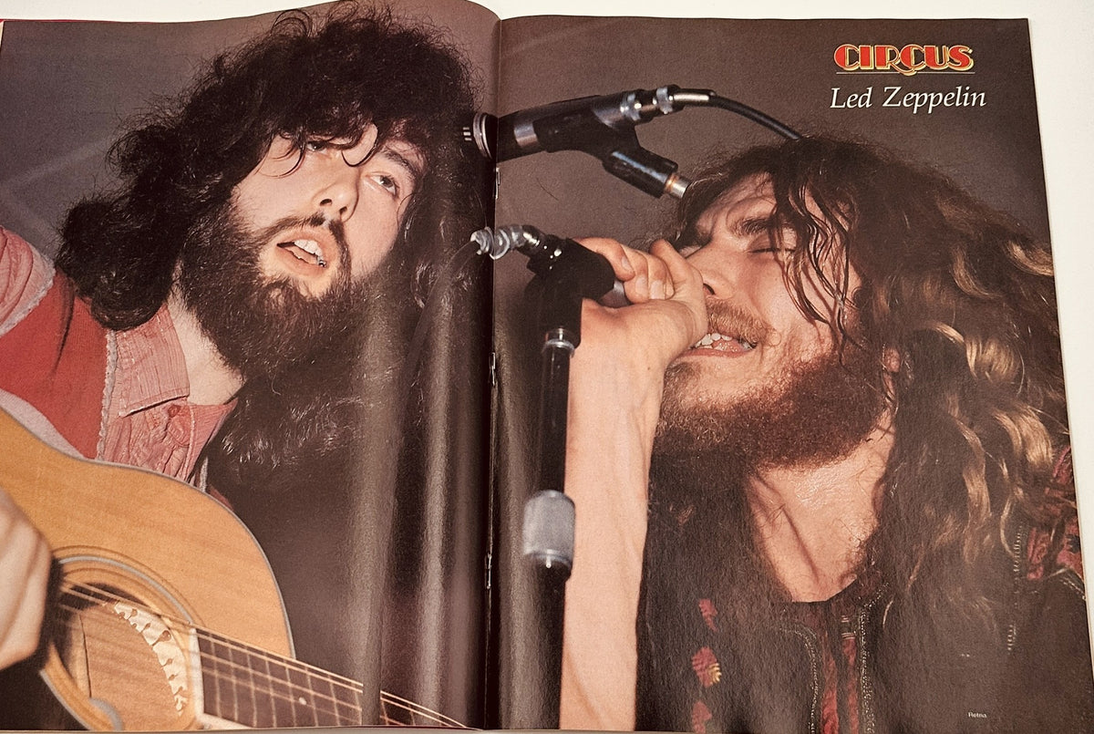 Two members of Led Zeppelin performing live, showcasing their dynamic stage presence. This image is featured in the 1980 Circus Magazine issue, celebrating rock legends.