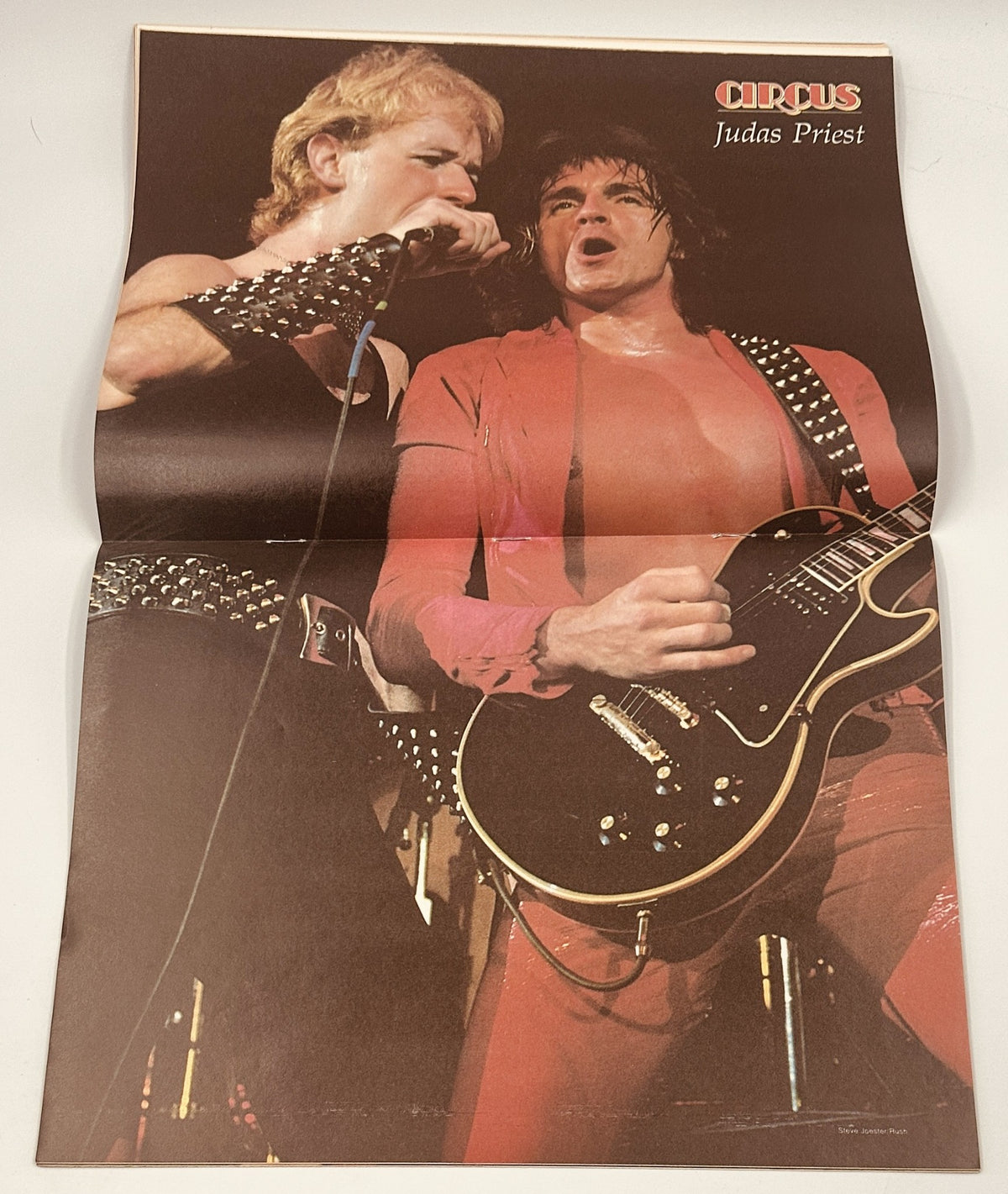 Judas Priest featured poster within the July 22, 1980 edition of Circus Magazine, showcasing the band during a live performance.