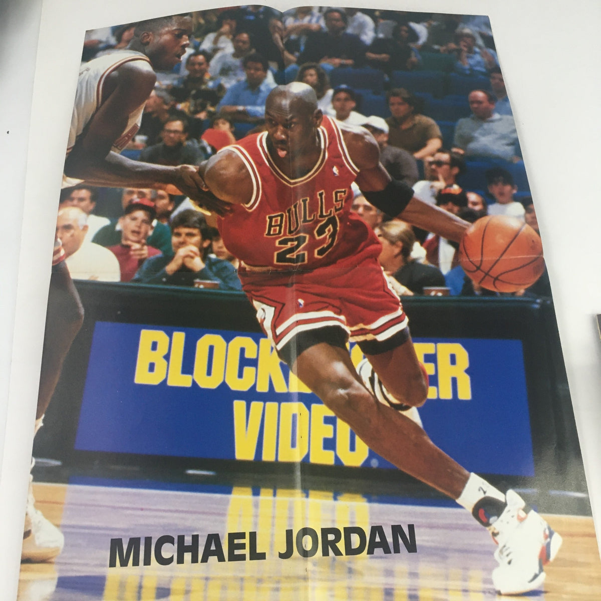 Pullout poster of Michael Jordan in action, dribbling a basketball for the Chicago Bulls, from Pro Basketball Illustrated Spring 1995.