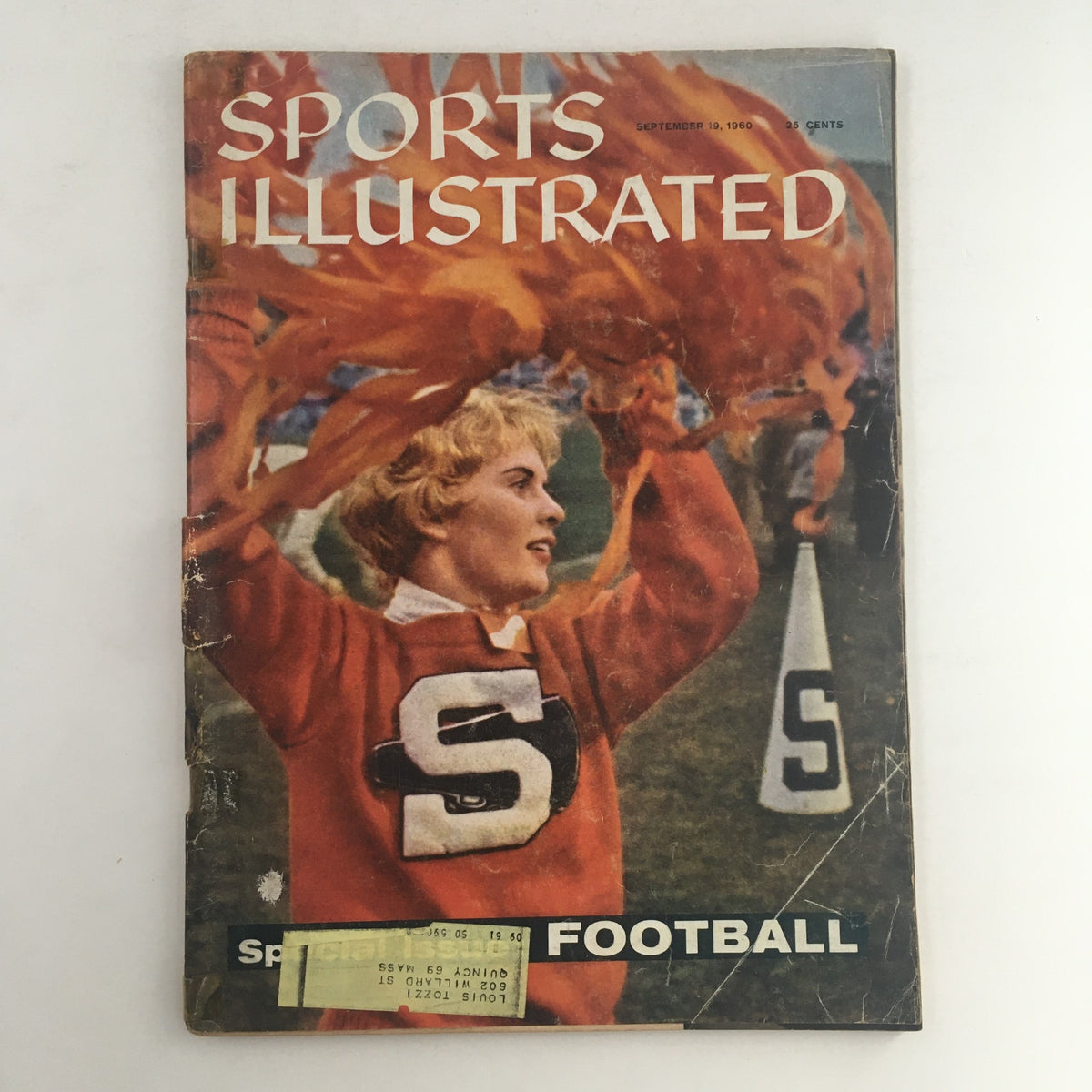 Cover of Sports Illustrated Magazine September 19 1960 featuring a cheerleader in a red sweater holding pom-poms, representing the football issue with Roger Bannister.