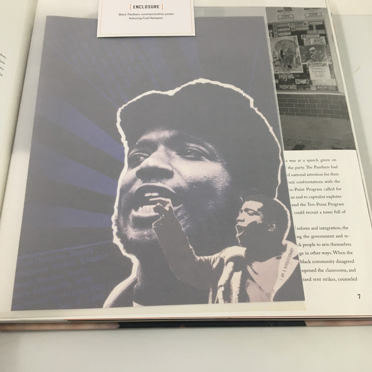 Interior page of the Tupac Shakur Legacy book featuring an artistic representation of a speaker passionately addressing an audience, reflecting themes of activism.