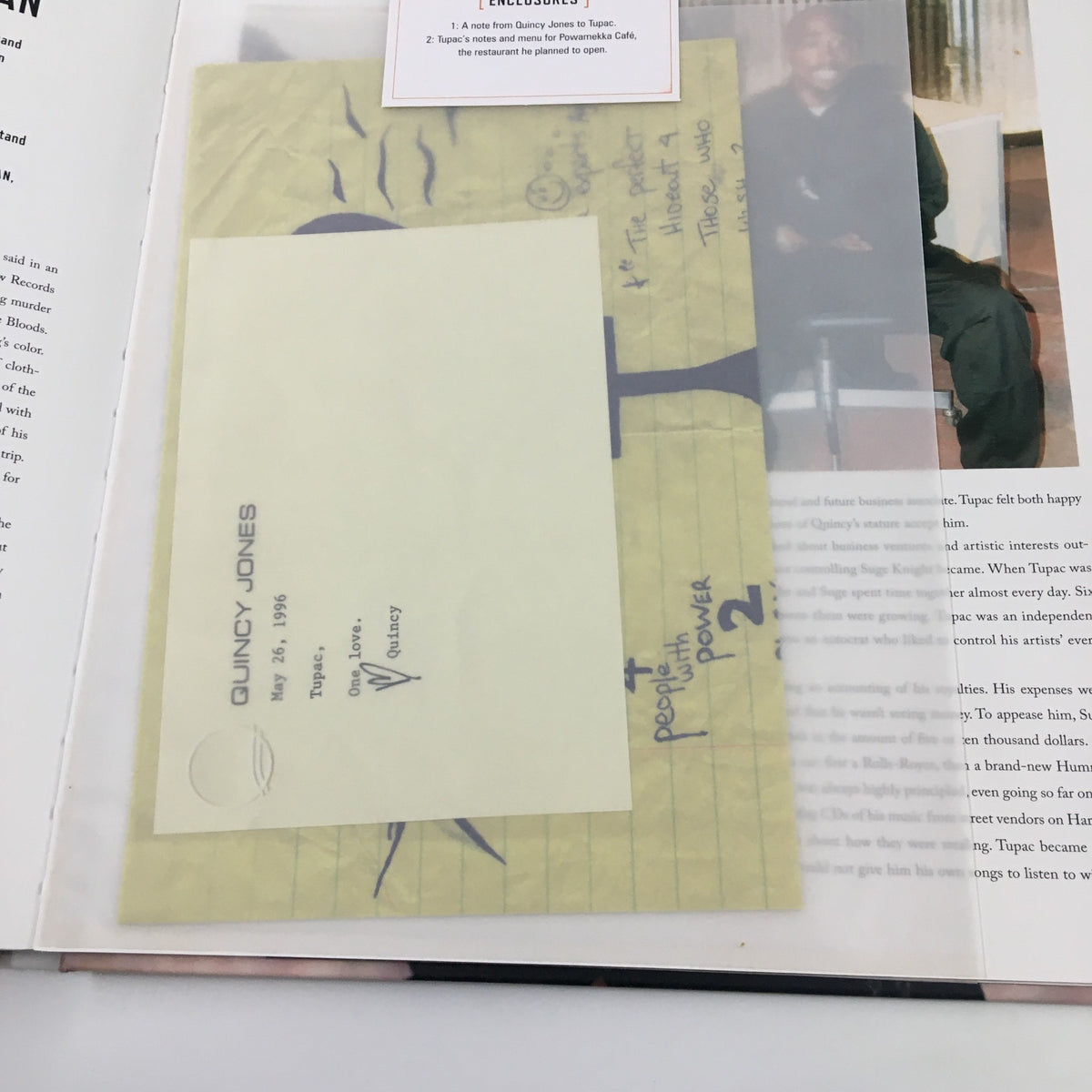 Inside the Tupac Shakur Legacy book showing notes from Quincy Jones dated May 24, 1996, highlighting important topics related to Tupac's music.