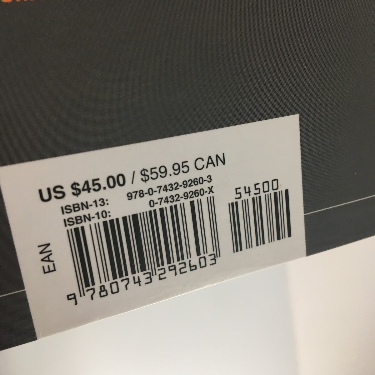 The price tag detailing the cost of the Tupac Shakur Legacy book, with pricing information in USD and CAD, reflecting its value.