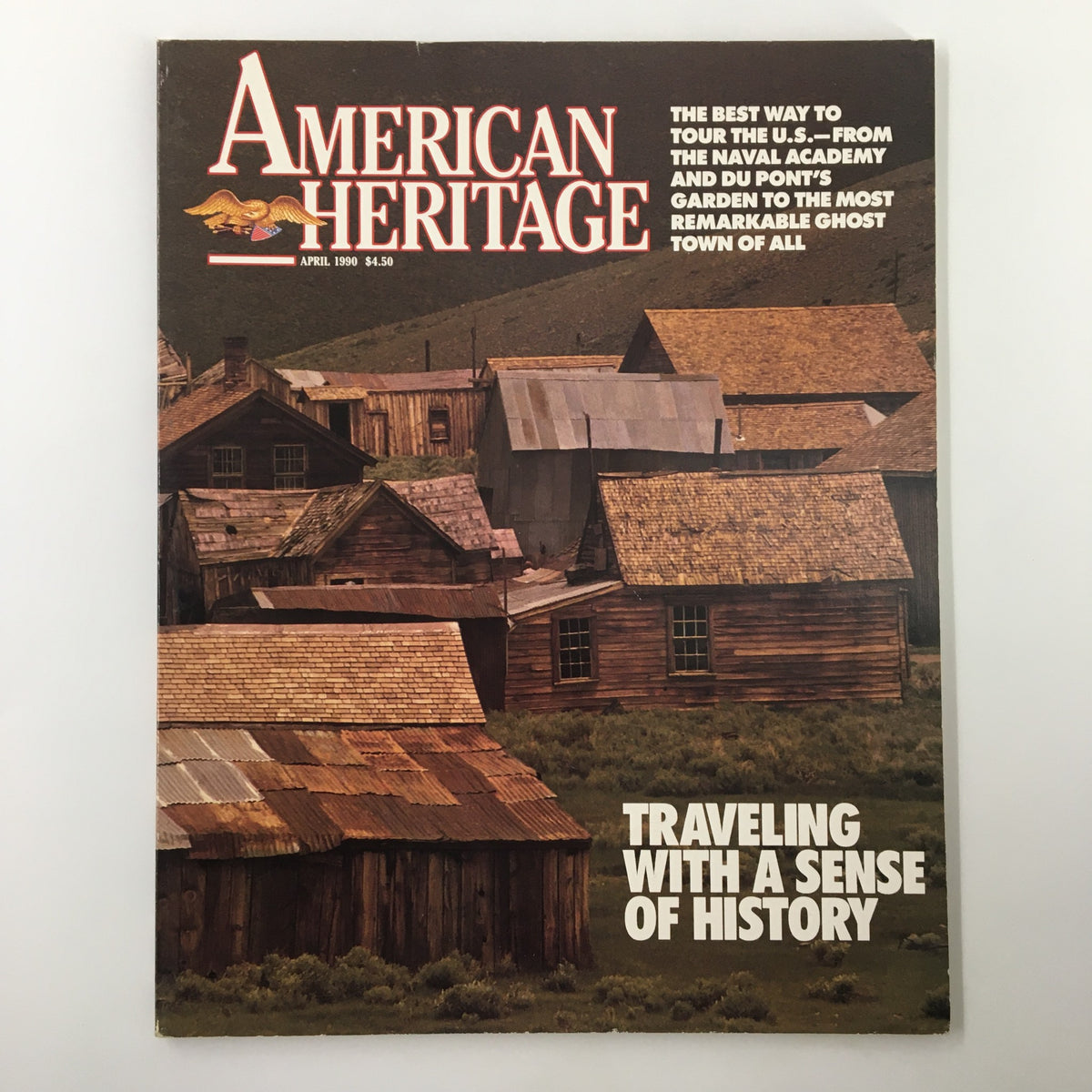 Cover of American Heritage Magazine April 1990 featuring the title 'The Buildings and Relics of Mining Days' with an image of weathered wooden structures and text promoting historical travel.