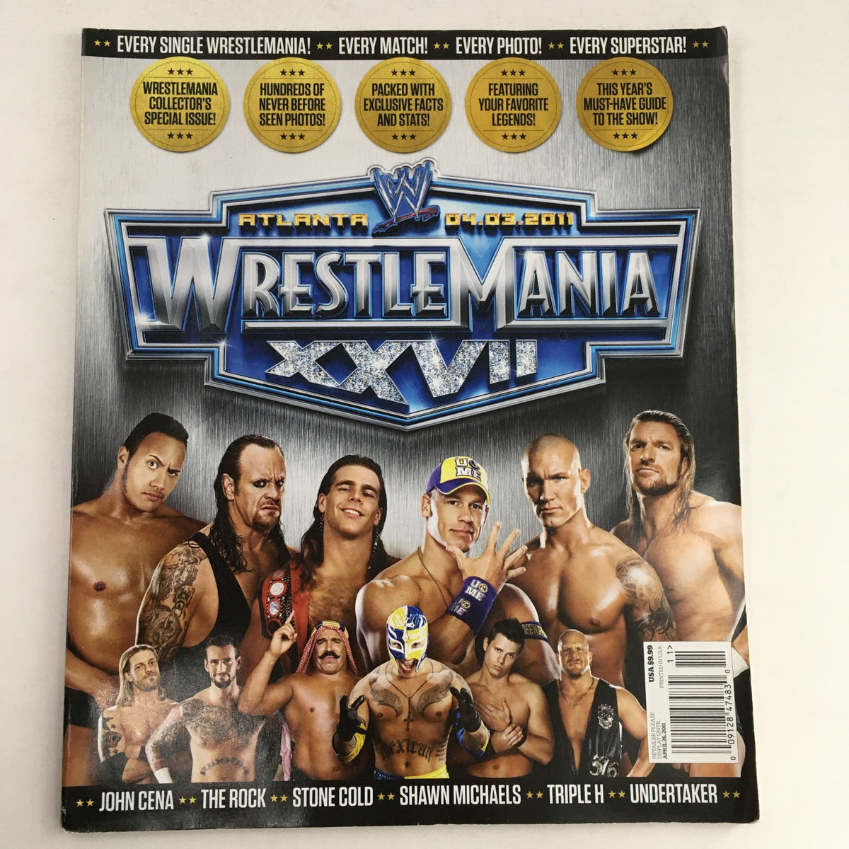 WWF Magazine 2011 Wrestle Mania XXVII cover featuring iconic wrestlers John Cena, The Rock, Stone Cold, Shawn Michaels, Triple H, and Undertaker. Perfect for fans and collectors of wrestling memorabilia.