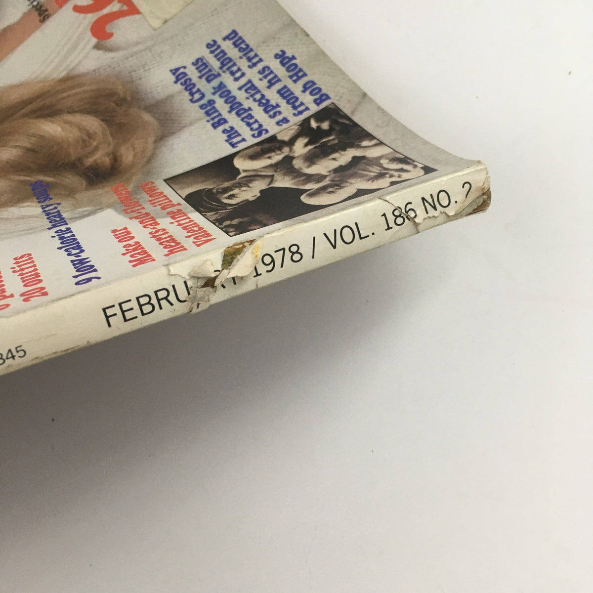 Detail view of the spine and edges of Good Housekeeping Magazine February 1978, displaying wear typical for vintage publications, including magazine's title and volume number.