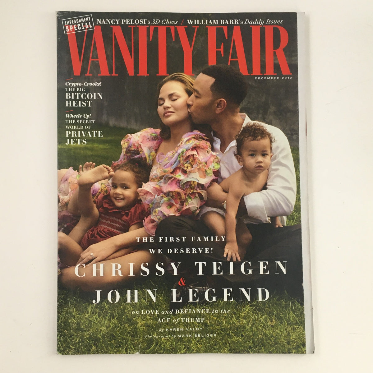 Vanity Fair Magazine December 2019 featuring Chrissy Teigen and John Legend on the cover, depicting a family portrait with four individuals including children, reflecting the theme of love and defiance.