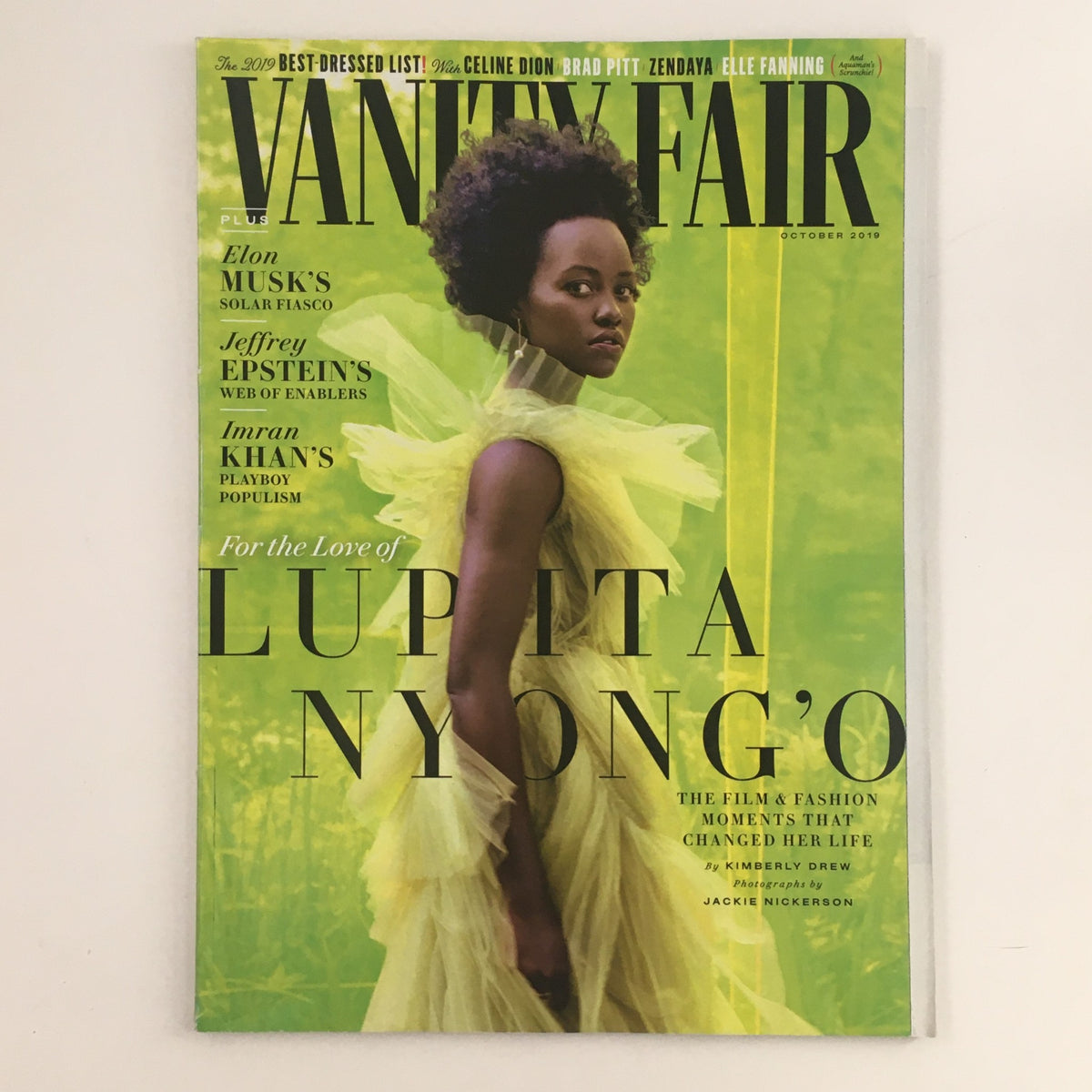 Cover of Vanity Fair magazine from October 2019 featuring Lupita Nyong'O, showcasing her in a stunning yellow dress, emphasizing themes of fashion and celebrity.