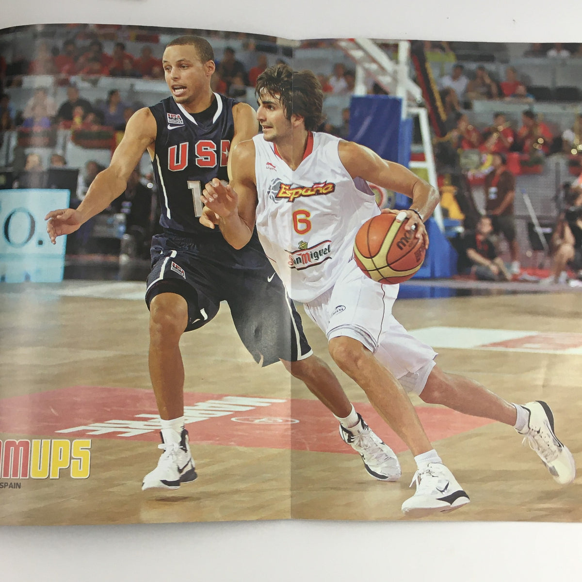 Inside spread of Slam Magazine November 2010 showing Stephen Curry and Ricky Rubio in action, with Curry playing defense in a basketball game.