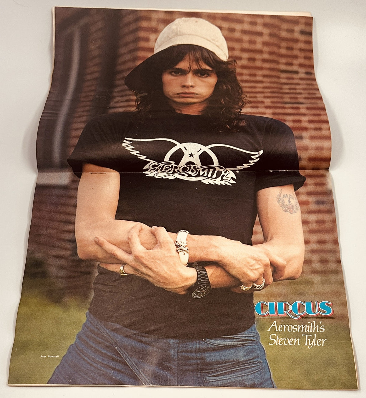 Full-page poster of Steven Tyler, the lead singer of Aerosmith, as featured in Circus Magazine March 16, 1978, showcasing his iconic style and persona.