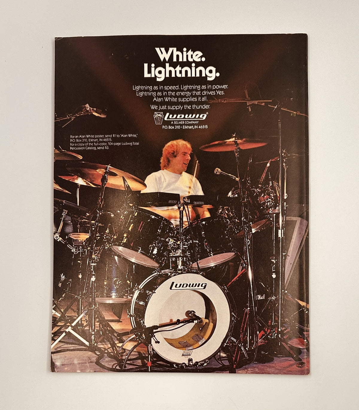 Promotional advertisement for Ludwig drums featuring a drummer playing in a dynamic performance. The ad highlights the powerful slogan 'White Lightning' along with the tagline about lightning speed and power. It accompanies the 'Circus Magazine August 31, 1984', featuring rock bands like Motley Crue, Van Halen, and Iron Maiden.