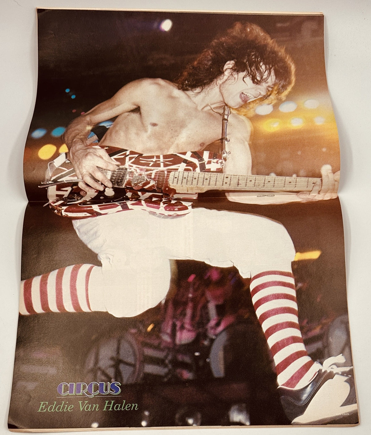 Eddie Van Halen performing live, featured in Circus Magazine, August 31, 1982. Image displays Van Halen with his iconic guitar style.