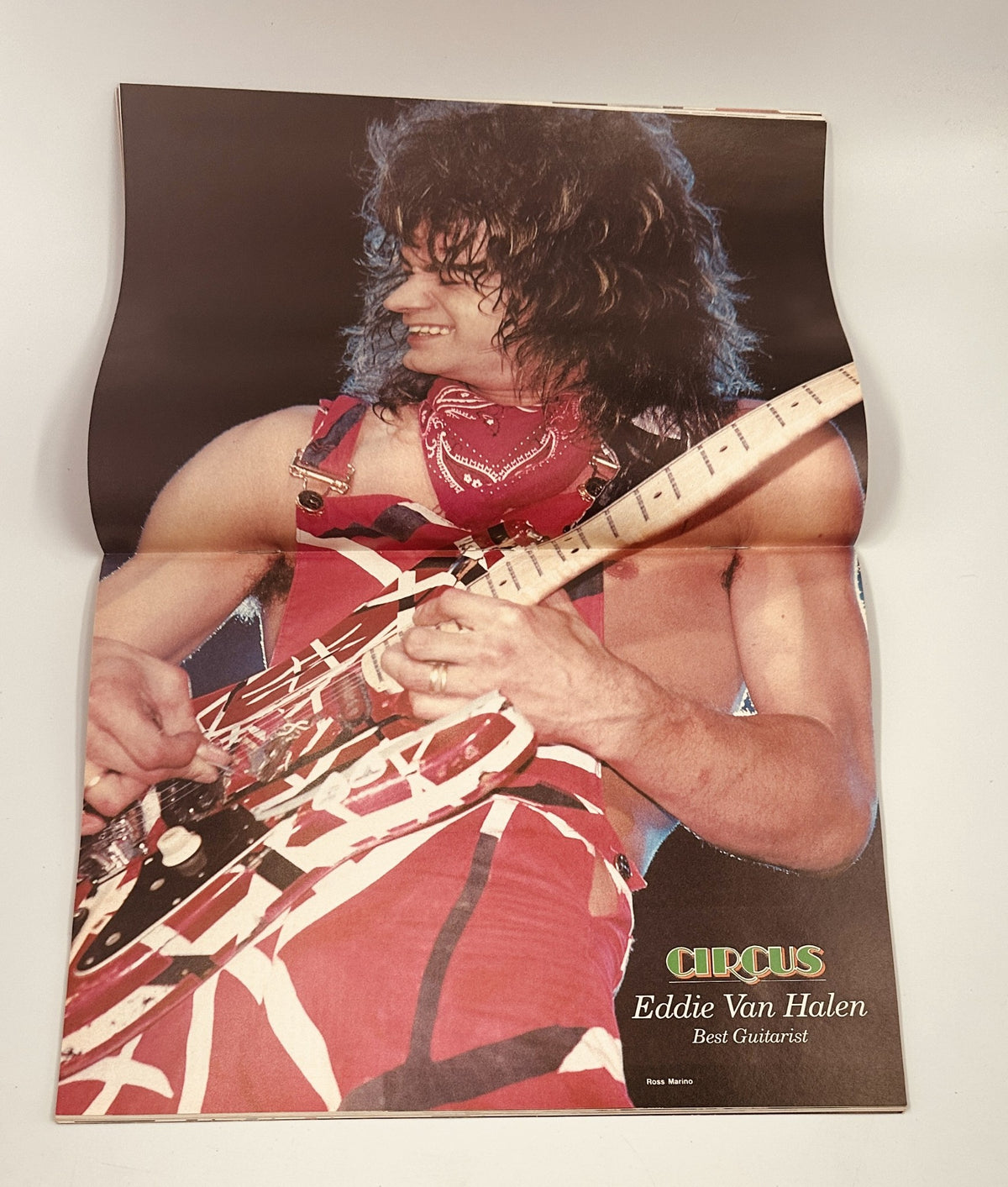 Circus Magazine February 29, 1984 featuring Eddie Van Halen as Best Guitarist, showcasing a vibrant poster of him playing guitar, highlighting his iconic style and talent.