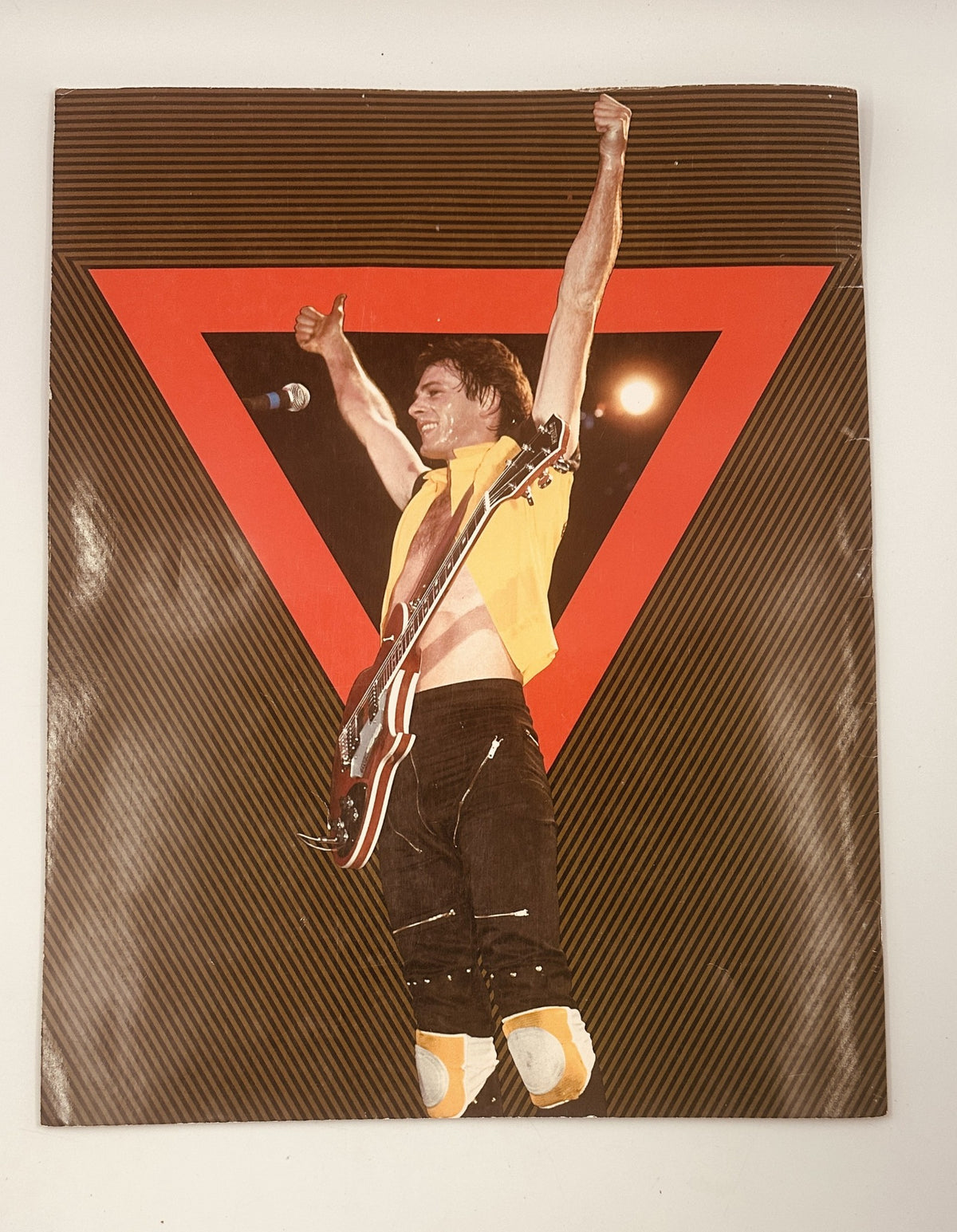Rick Springfield Magazine 1982 Sweat For Success Tour Concert Photos featuring an energetic performer with arms raised on stage, showcasing vintage concert memorabilia from the early 1980s.