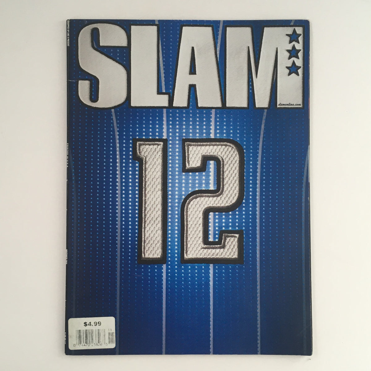Cover of Slam Magazine November 2010 featuring a blue design with the number 12, showcasing USA Team and Stephen Curry, a collectible vintage magazine.