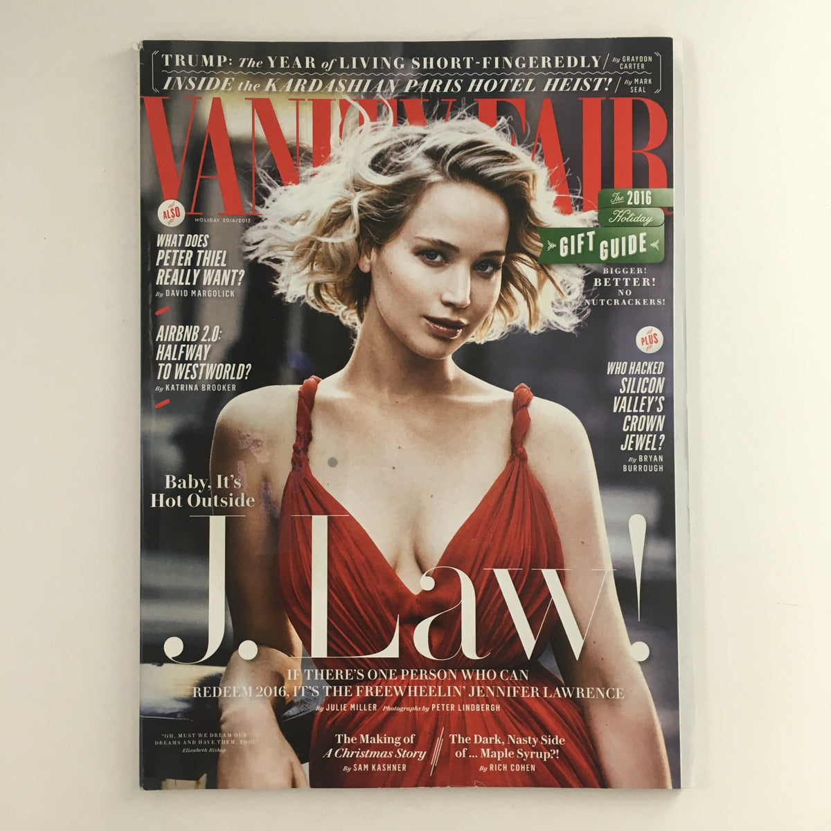 Vanity Fair Magazine Holiday 2016 featuring Jennifer Lawrence on the cover, showcasing her glamorous look and highlighting the title 'Freewheelin' J. Law!' This vintage magazine captures the essence of Hollywood in 2016.