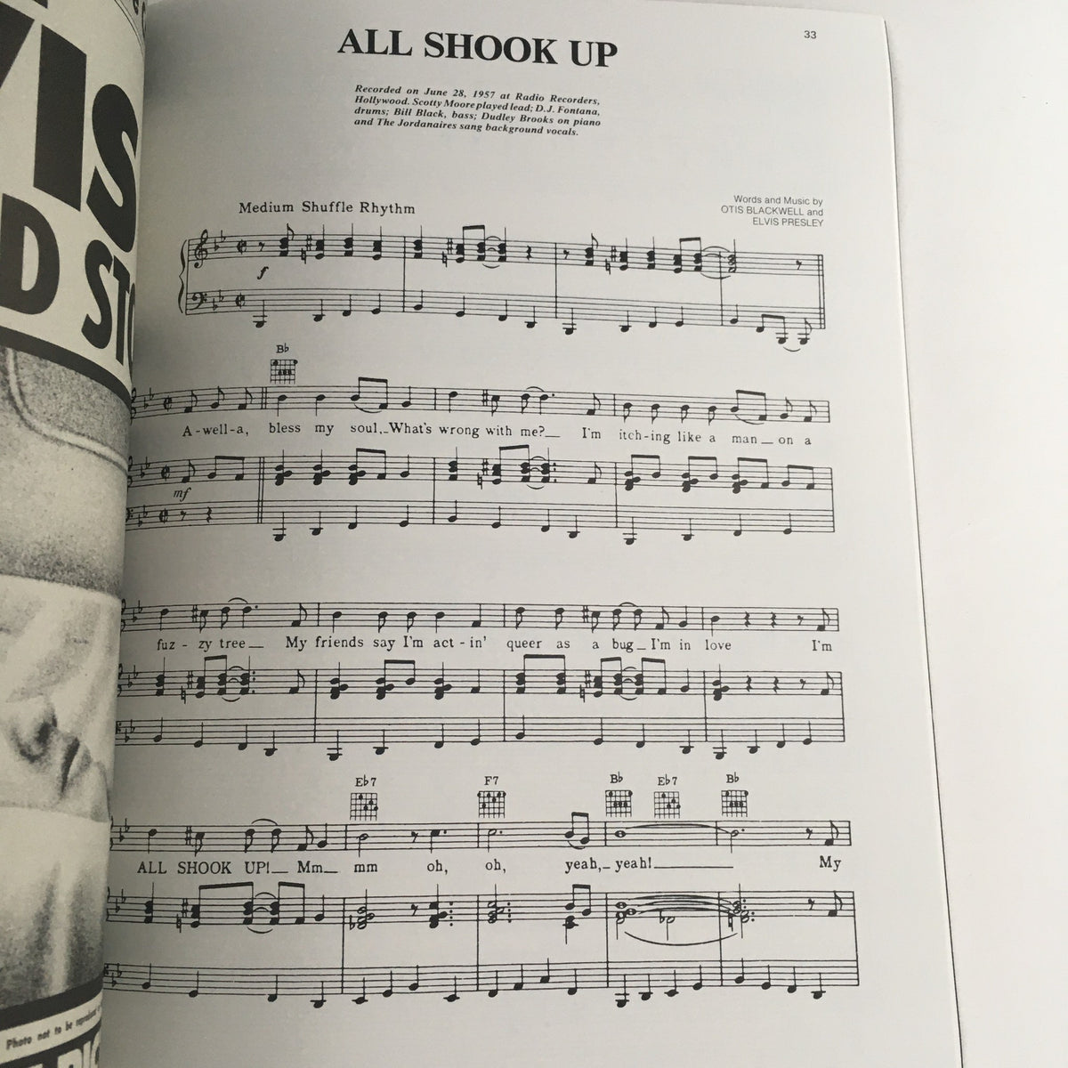 Sheet music page from Elvis Aron Presley 1935-1977 The Memorial Album showcasing the lyrics and musical notes for the song 'All Shook Up', capturing a classic piece of Elvis's musical legacy.